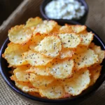Crispy high-protein cottage cheese chips arranged on a baking tray lined with parchment paper.