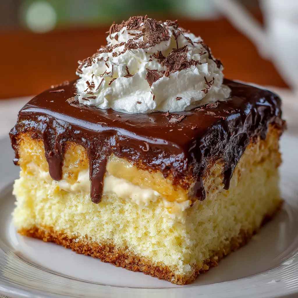 Boston Cream Poke Cake with rich chocolate ganache and creamy vanilla filling