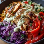 Mediterranean Chicken Bowls with Roasted Red Peppers, Cabbage & Ginger Tahini